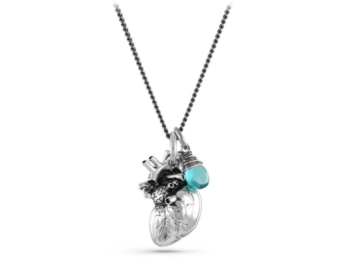 Anatomical Heart Necklace with Blue Topaz in Silver - shown on gunmetal chain