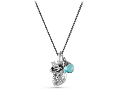 Small Anatomical Heart Necklace with Blue Topaz in Silver - shown on gunmetal chain