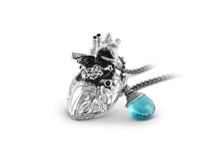 Anatomical Heart Necklace with Blue Topaz in Silver - shown on gunmetal chain