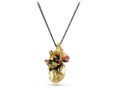 Anatomical Heart Necklace with Garnet in Gold - shown on gunmetal chain