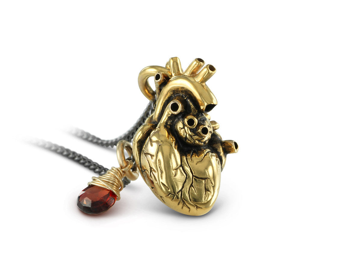 Anatomical Heart Necklace with Garnet in Gold - shown on gunmetal chain