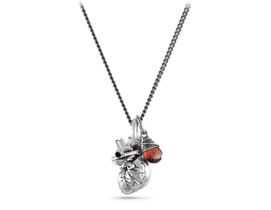 Small Anatomical Heart Necklace with Garnet in Silver - shown on gunmetal chain