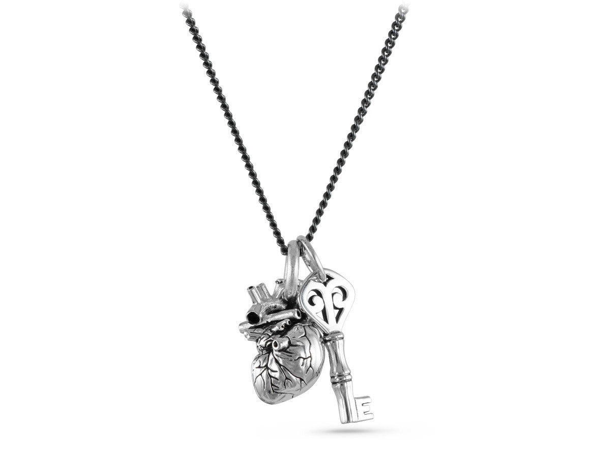 Small Anatomical Heart & Key Necklace in Silver - shown on gunmetal chain