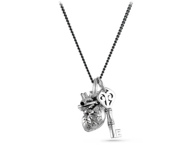 Small Anatomical Heart & Key Necklace in Silver - shown on gunmetal chain