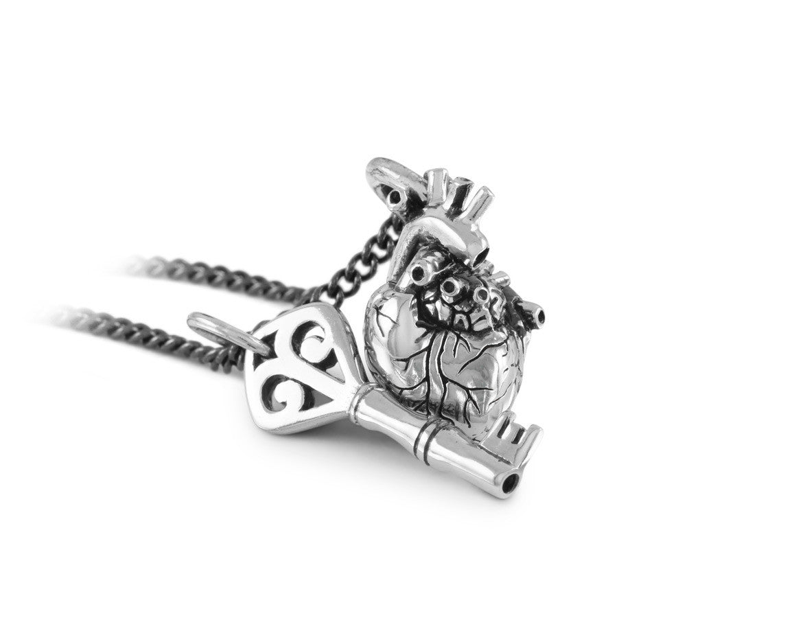 Small Anatomical Heart & Key Necklace in Silver - shown on gunmetal chain