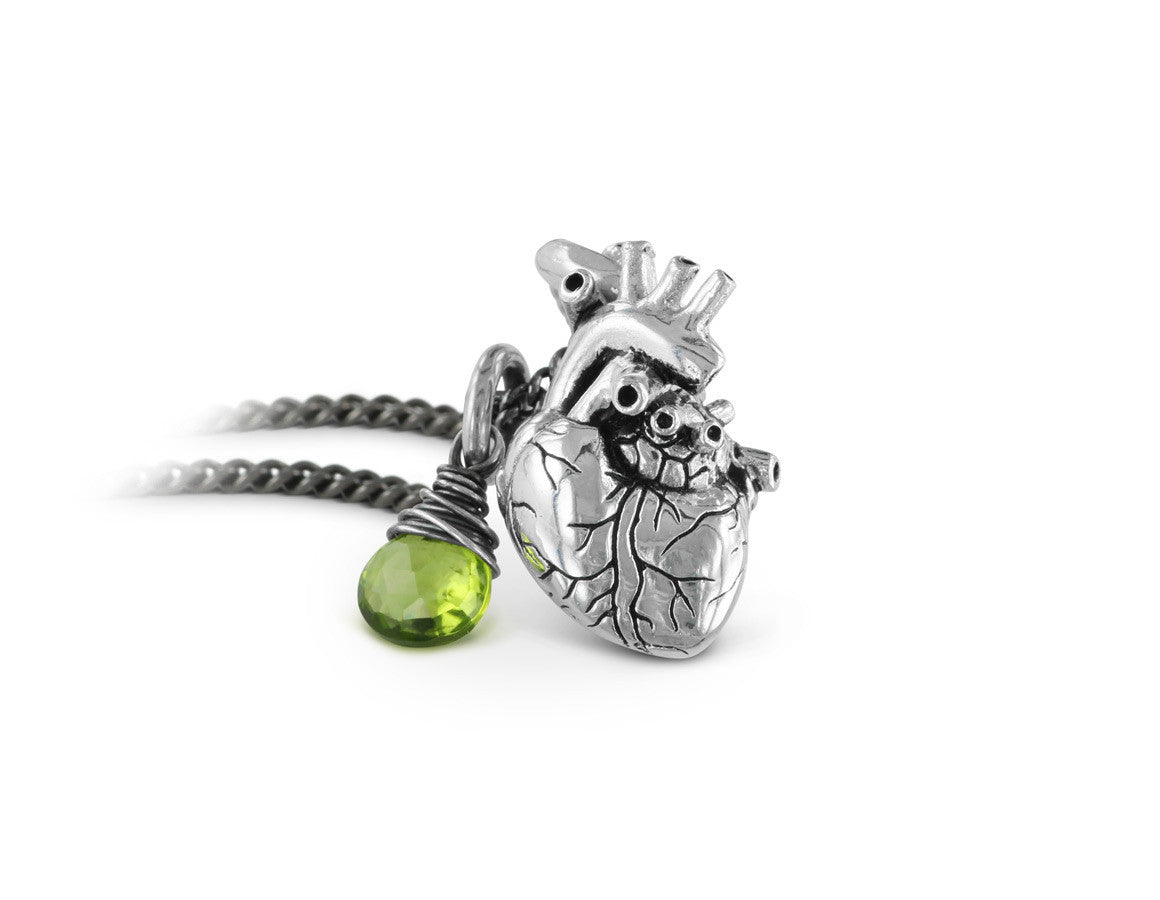 Small Anatomical Heart Necklace with Peridot in Silver - shown on gunmetal chain