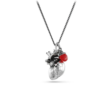 Anatomical Heart Necklace with Ruby in Silver - shown on gunmetal chain