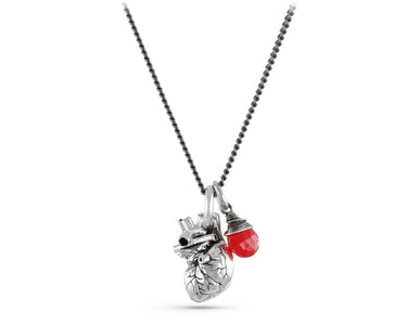 Small Anatomical Heart Necklace with Ruby in Silver - shown on gunmetal chain