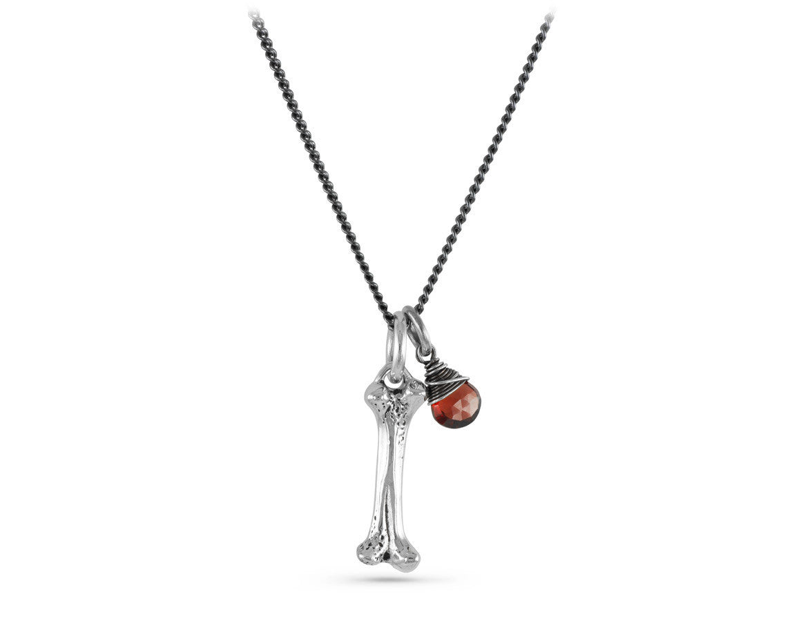 Small Bone Necklace with Garnet in Silver - shown on gunmetal chain