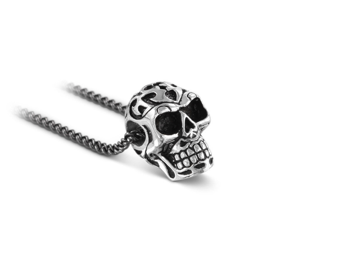 Small Ornate Skull Necklace in Silver - shown on gunmetal chain