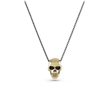 Small Skull Necklace in Bronze - shown on gunmetal chain