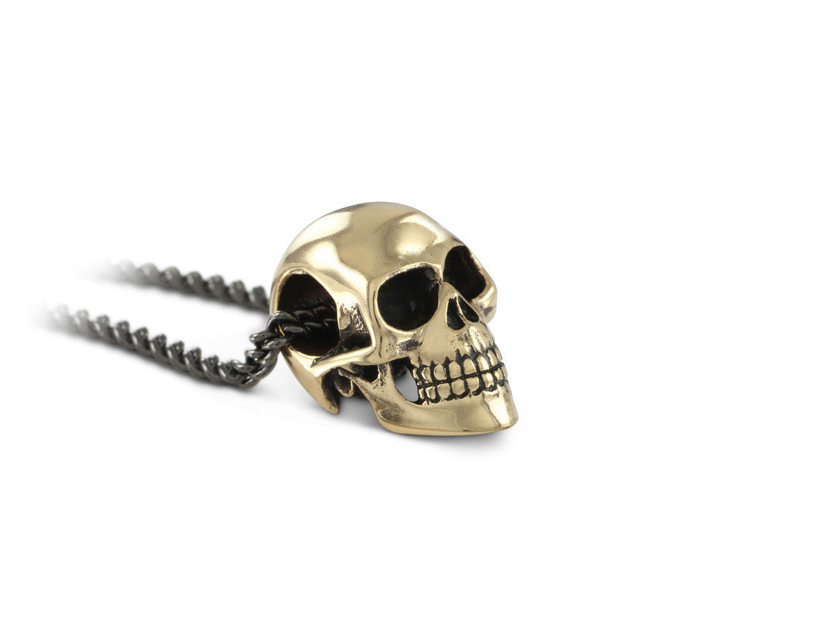 Small Skull Necklace in Bronze - shown on gunmetal chain