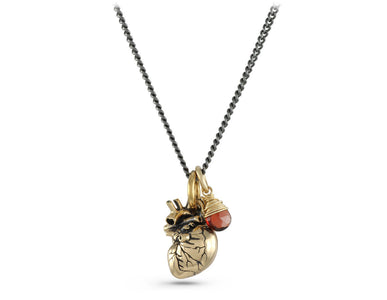 Small Anatomical Heart with Garnet Necklace in Bronze - shown on gunmetal chain