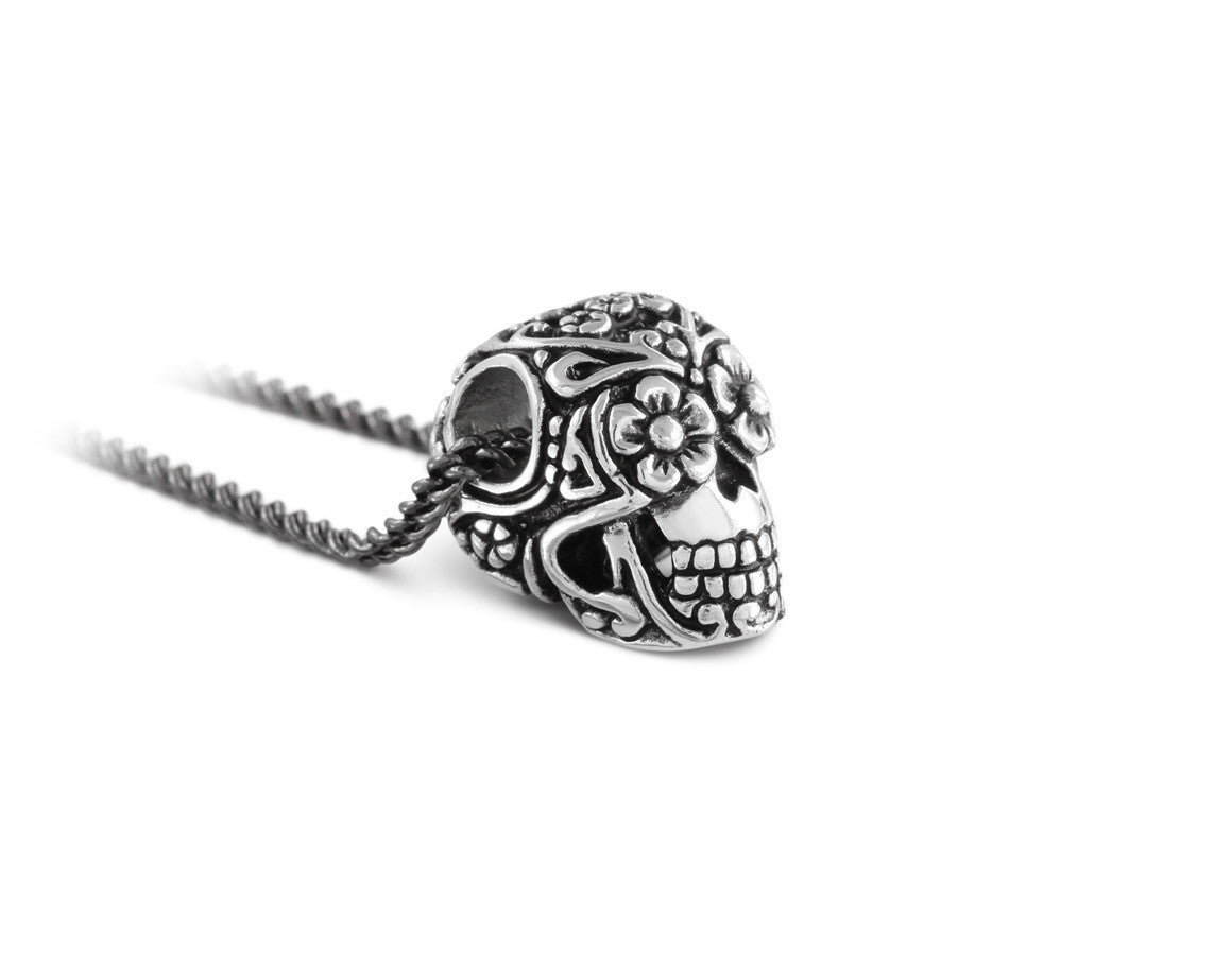 Small Day of the Dead Skull Necklace in Silver - shown on gunmetal chain